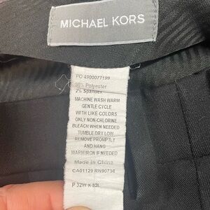 Men’s Michael Kors Trousers in black.